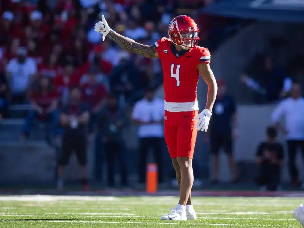 Nov 30, 2024; Tucson, Arizona, USA; Arizona Wildcats wide receiver Tetairoa McMillan (4) against the Arizona State Sun Devils during the Territorial Cup at Arizona Stadium. Credit: Mark J. Rebilas-Imagn Images