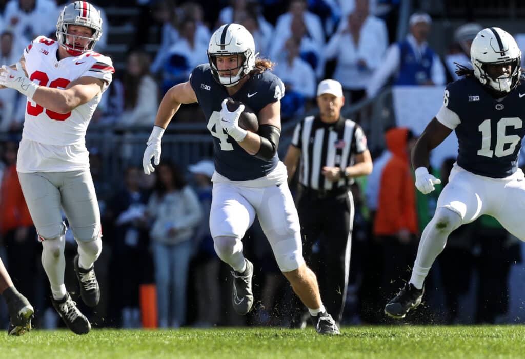 Nov 2, 2024; University Park, Pennsylvania, USA; Penn State Nittany Lions tight end Tyler Warren (44) runs with the ball during the first quarter against the Ohio State Buckeyes at Beaver Stadium. Mandatory Credit: Matthew O'Haren-Imagn Images